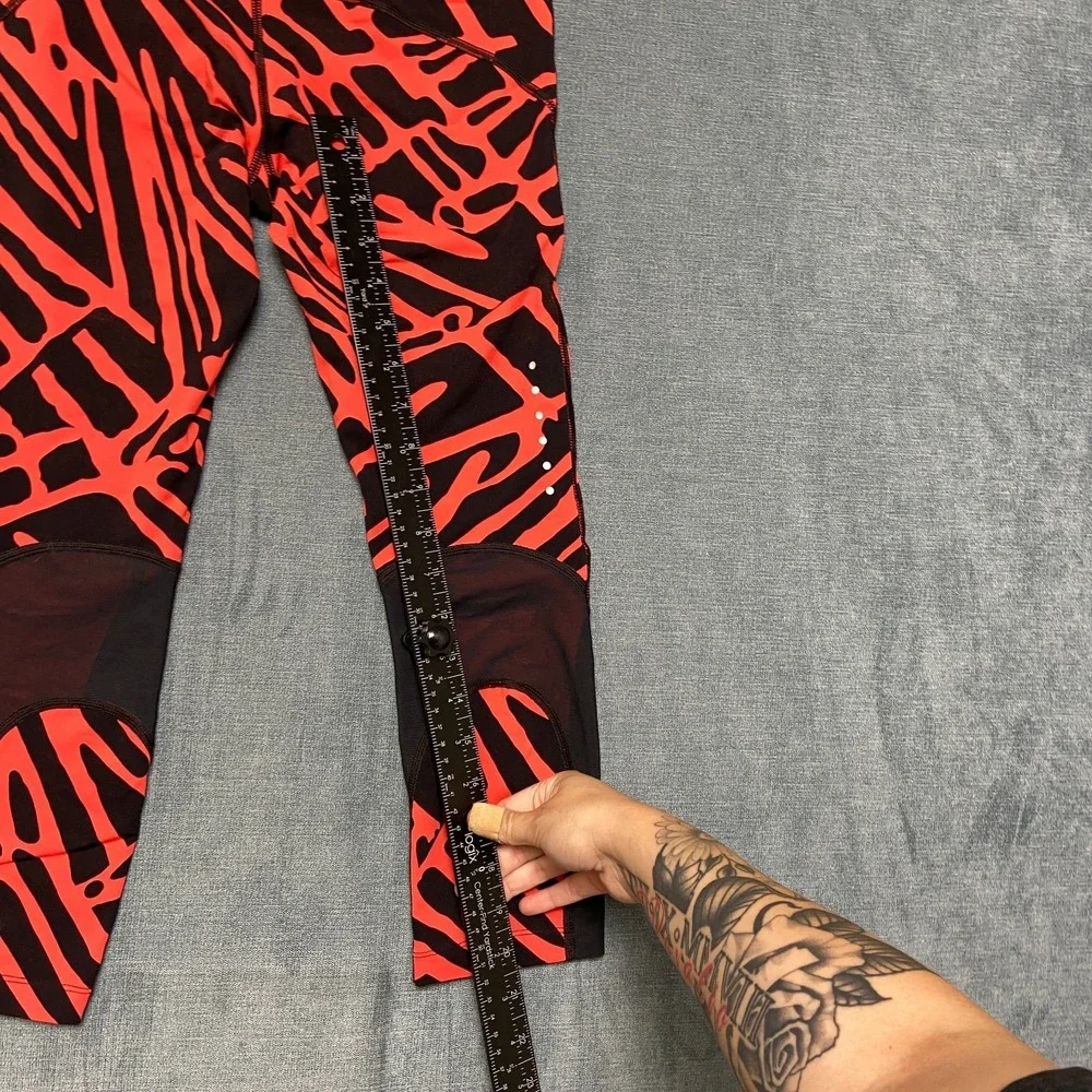 Nike Dri Fit Power Epic Lux Capri Leggings Womens XS Black Orange Abstract Print